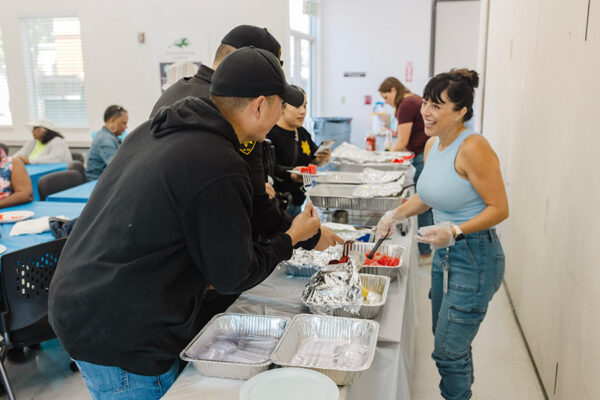 young ladies serving breakfast to olders