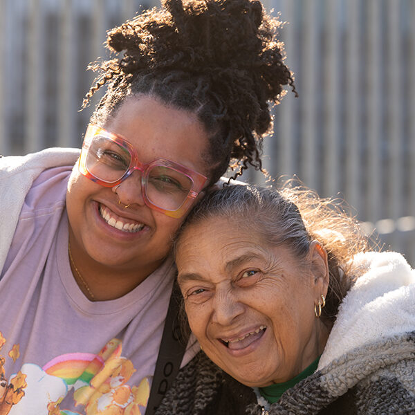 two women hugging and smiling