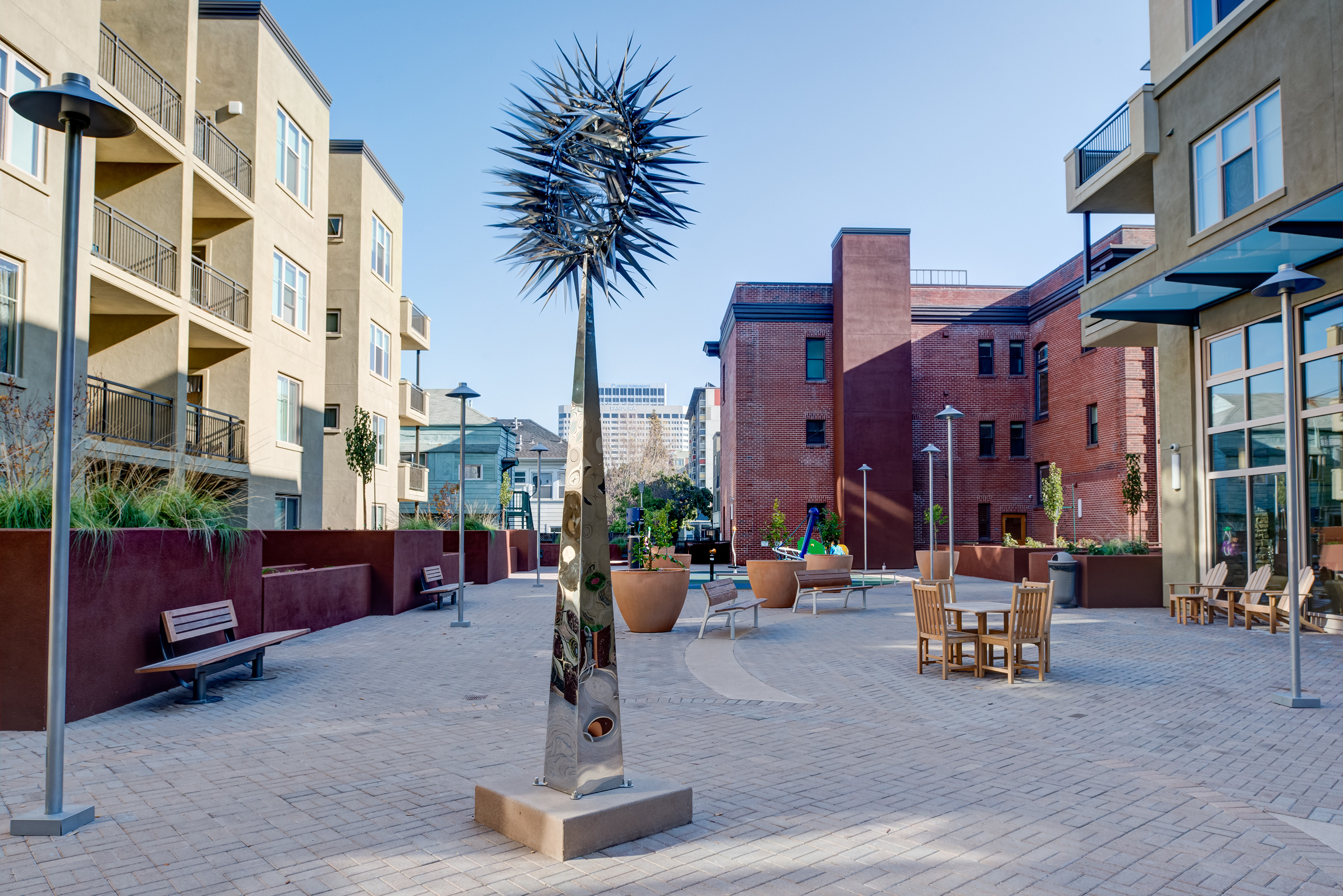 An urban courtyard and sculpture.