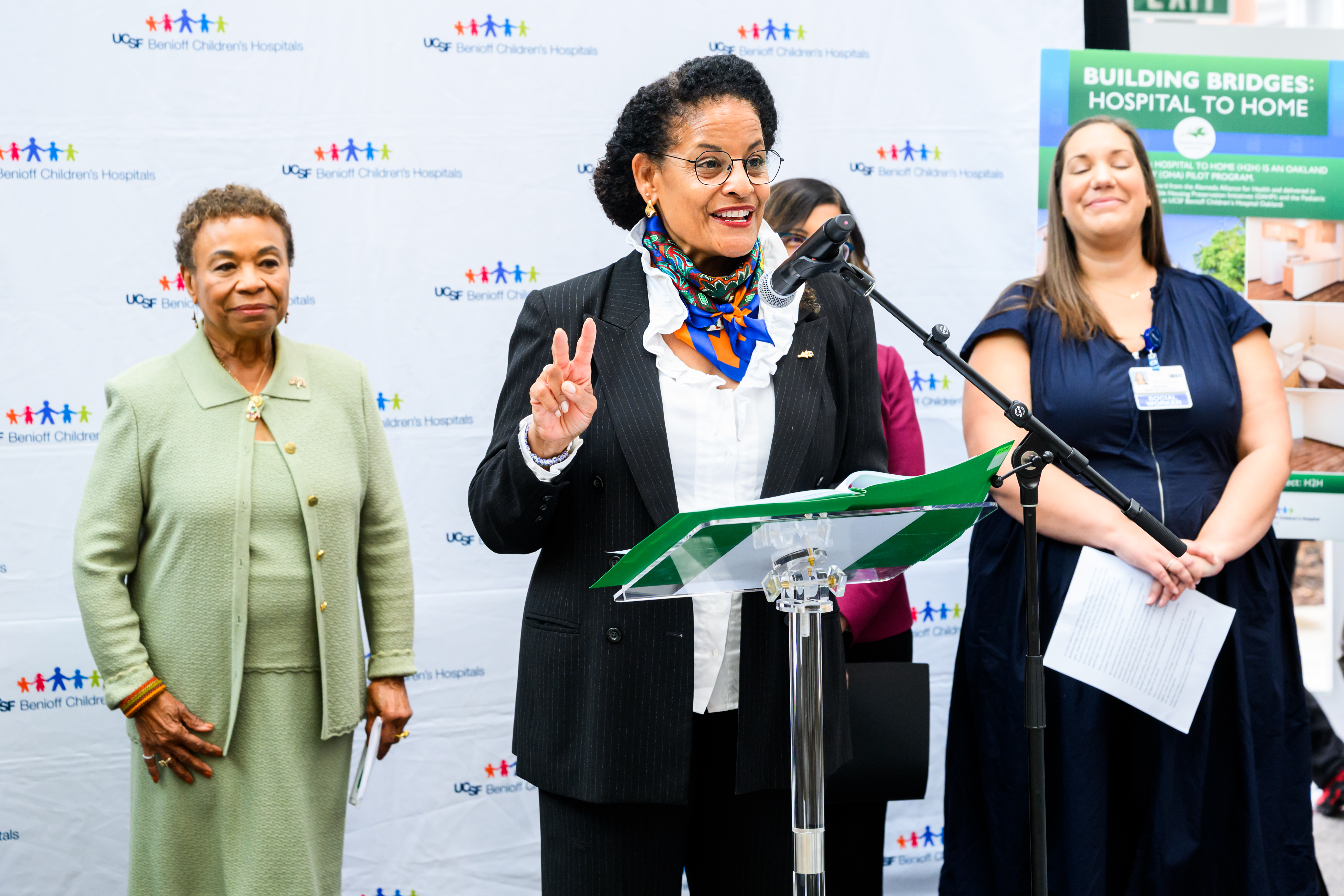 Oakland Housing Authority Executive Director Patricia Wells speaks at a podium announcing the Building Bridges: Hospital to Home program at UCSF Benioff Children’s Hospital Oakland.