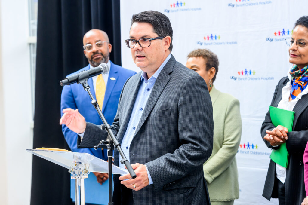 Matthew Woodruff, CEO of Alameda Alliance for Health, speaks at the Building Bridges: Hospital to Home press conference in Oakland.