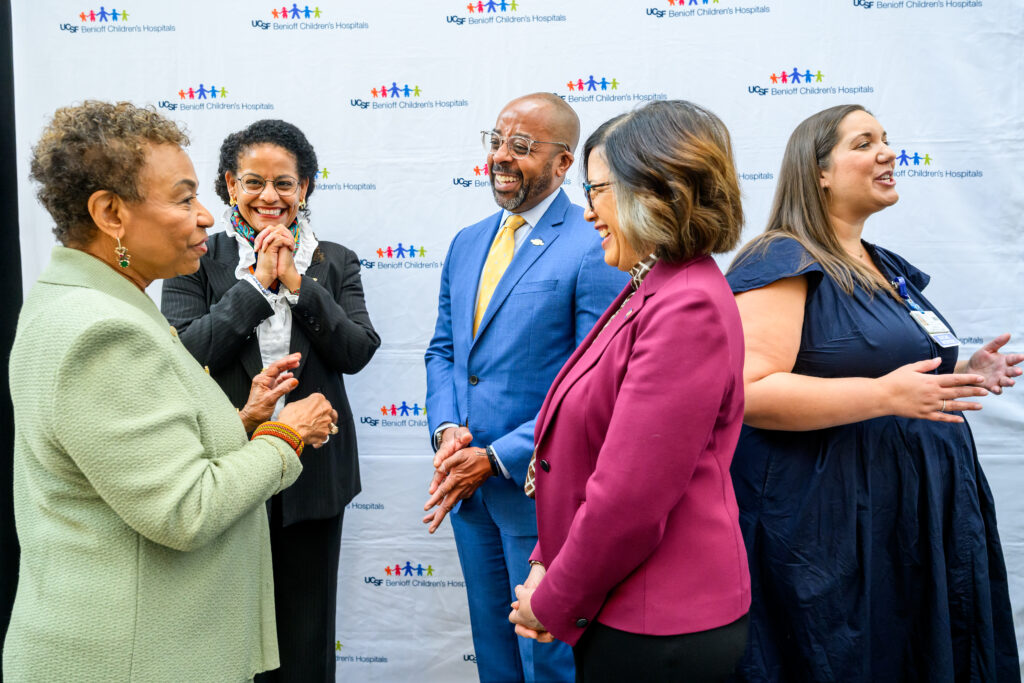 Oakland Mayor Barbara Lee and partners talk together before the Building Bridges: Hospital to Home press conference at UCSF Benioff Children’s Hospital Oakland.