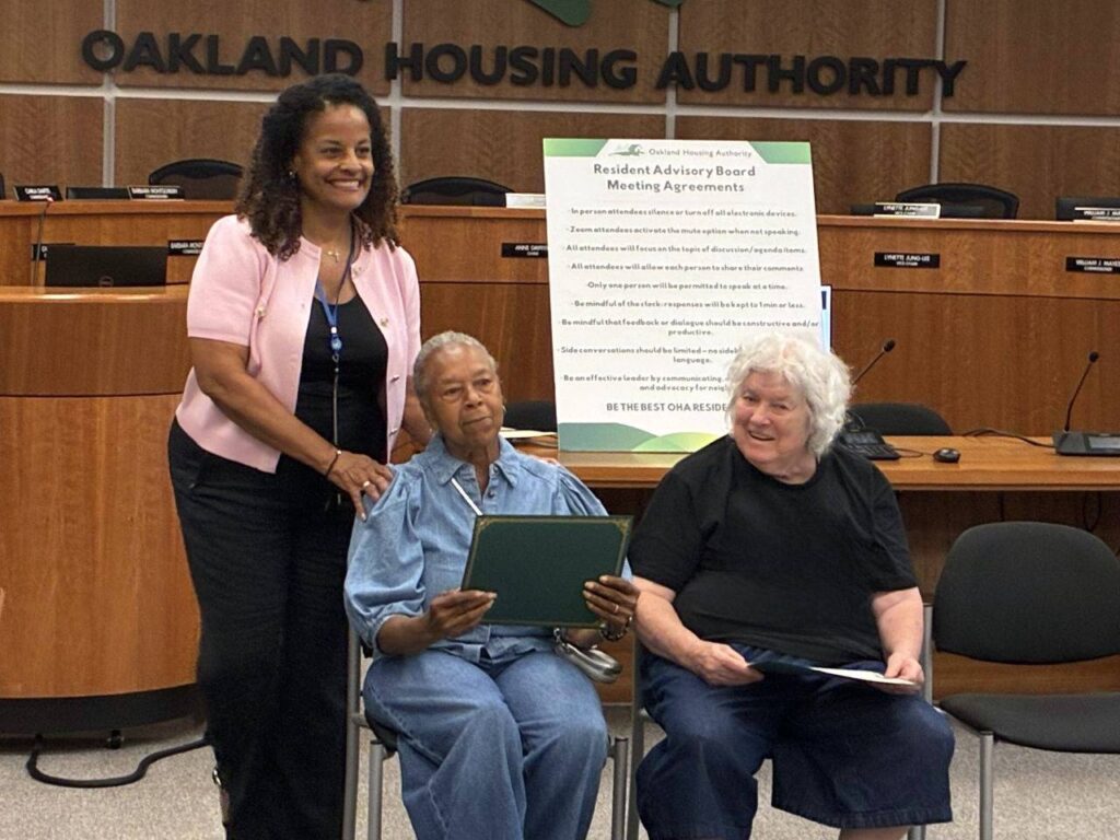 Oakland Housing Authority (OHA) Executive Director Patricia Wells poses with members of the Resident Advisory Board on August 12, 2026.